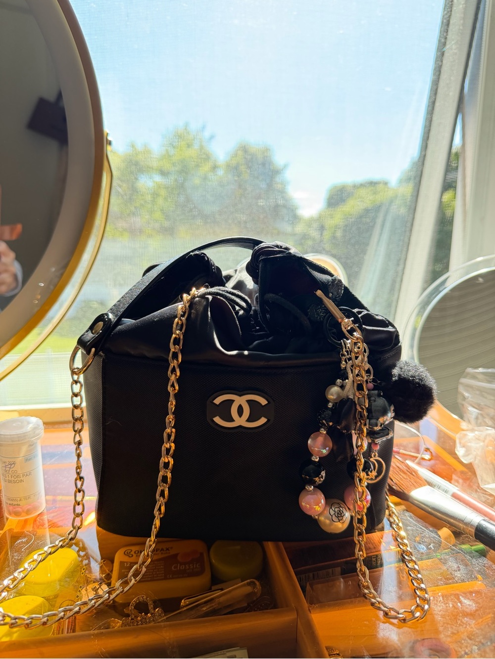 Milk Makeup Black Quilted Drawstring Crossbody with Gold Chain & Charm